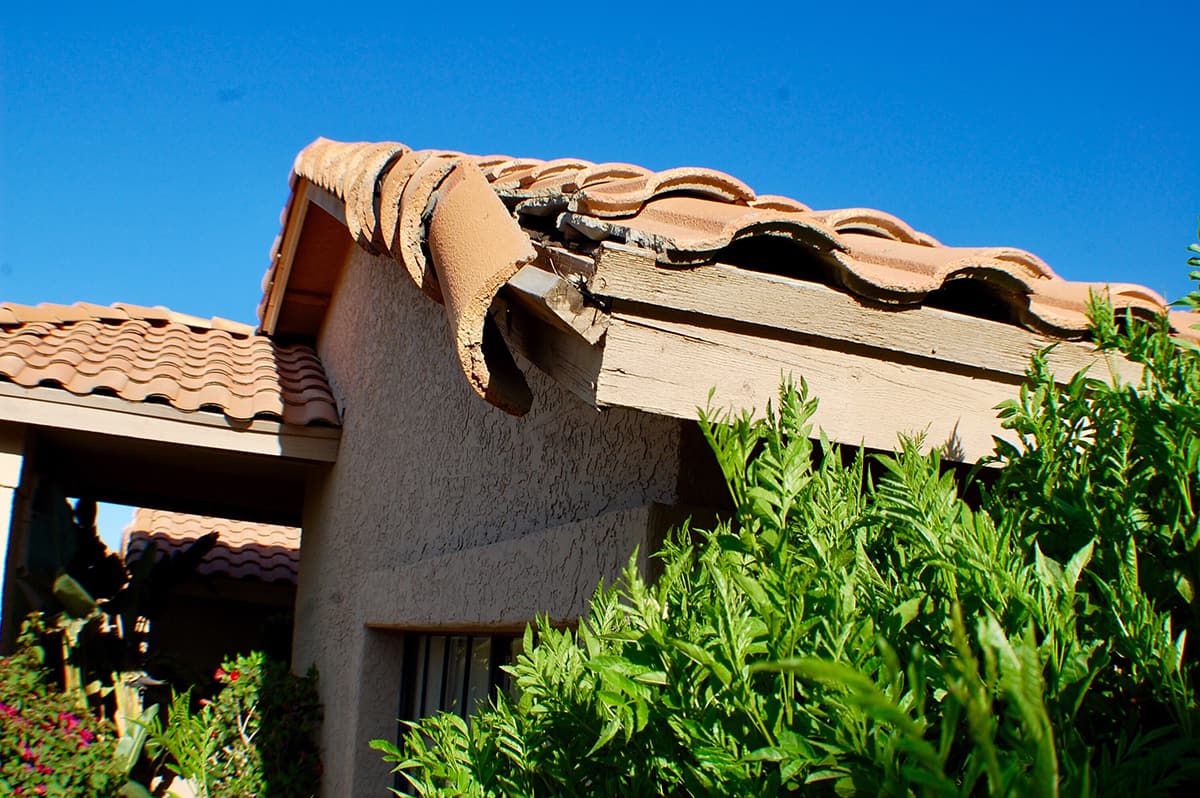 Damaged tiled roof area for roof insurance claim documentation