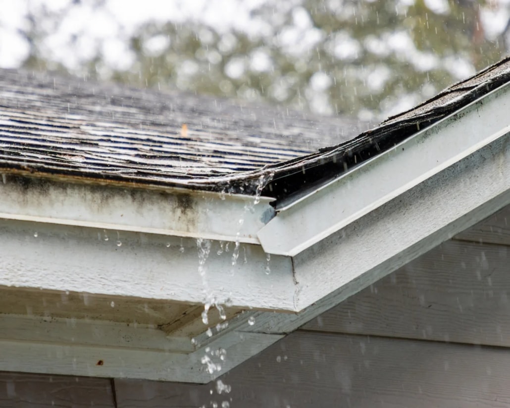 Weathered roof edge and gutter detail before storm season maintenance