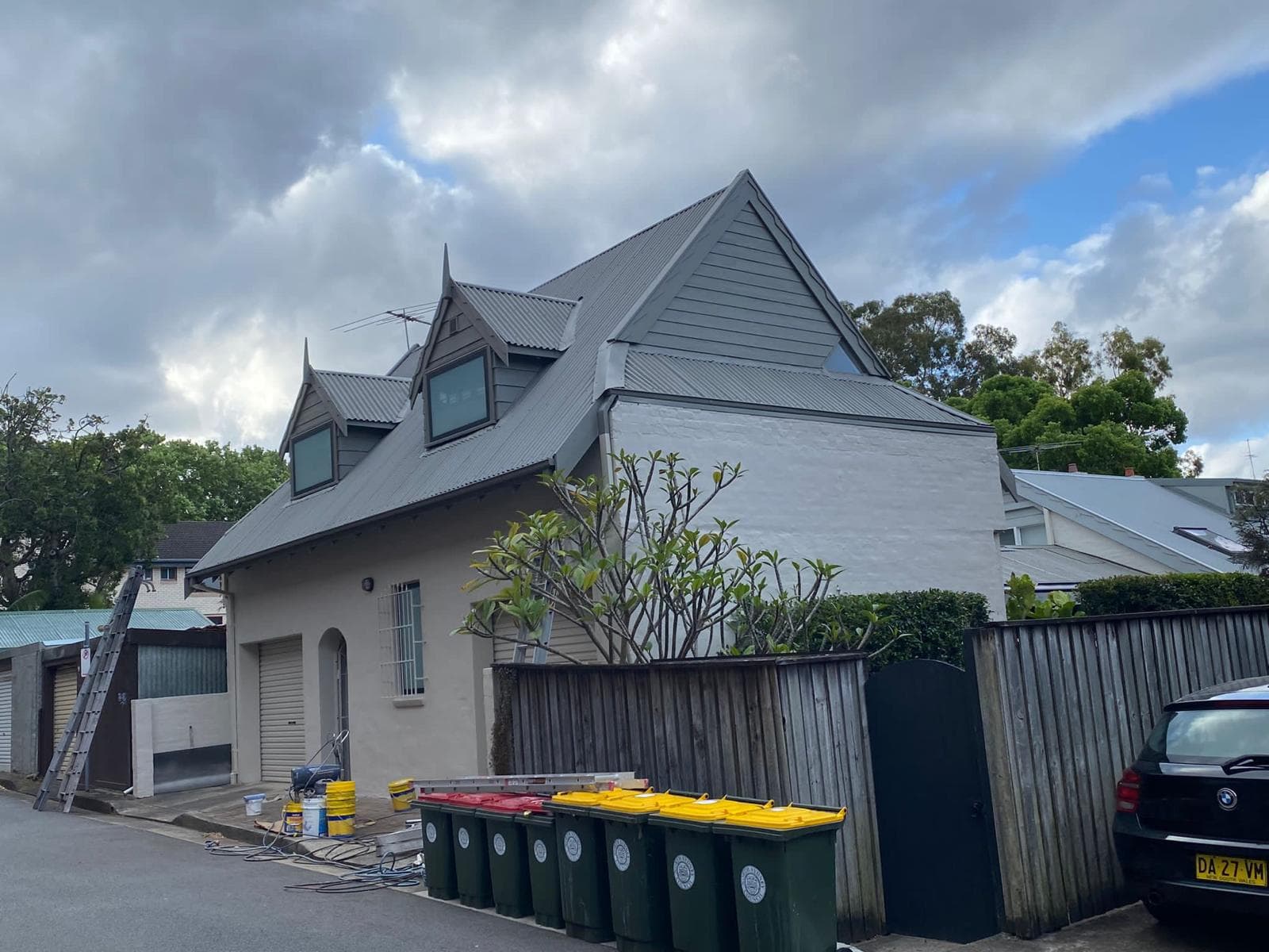 Character home street view showing the metal roof form