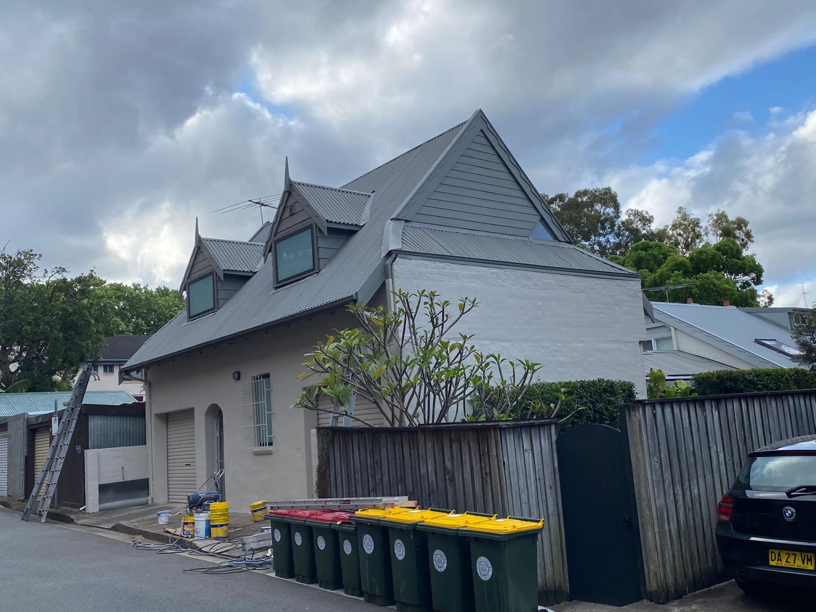 Character home street view showing the metal roof form