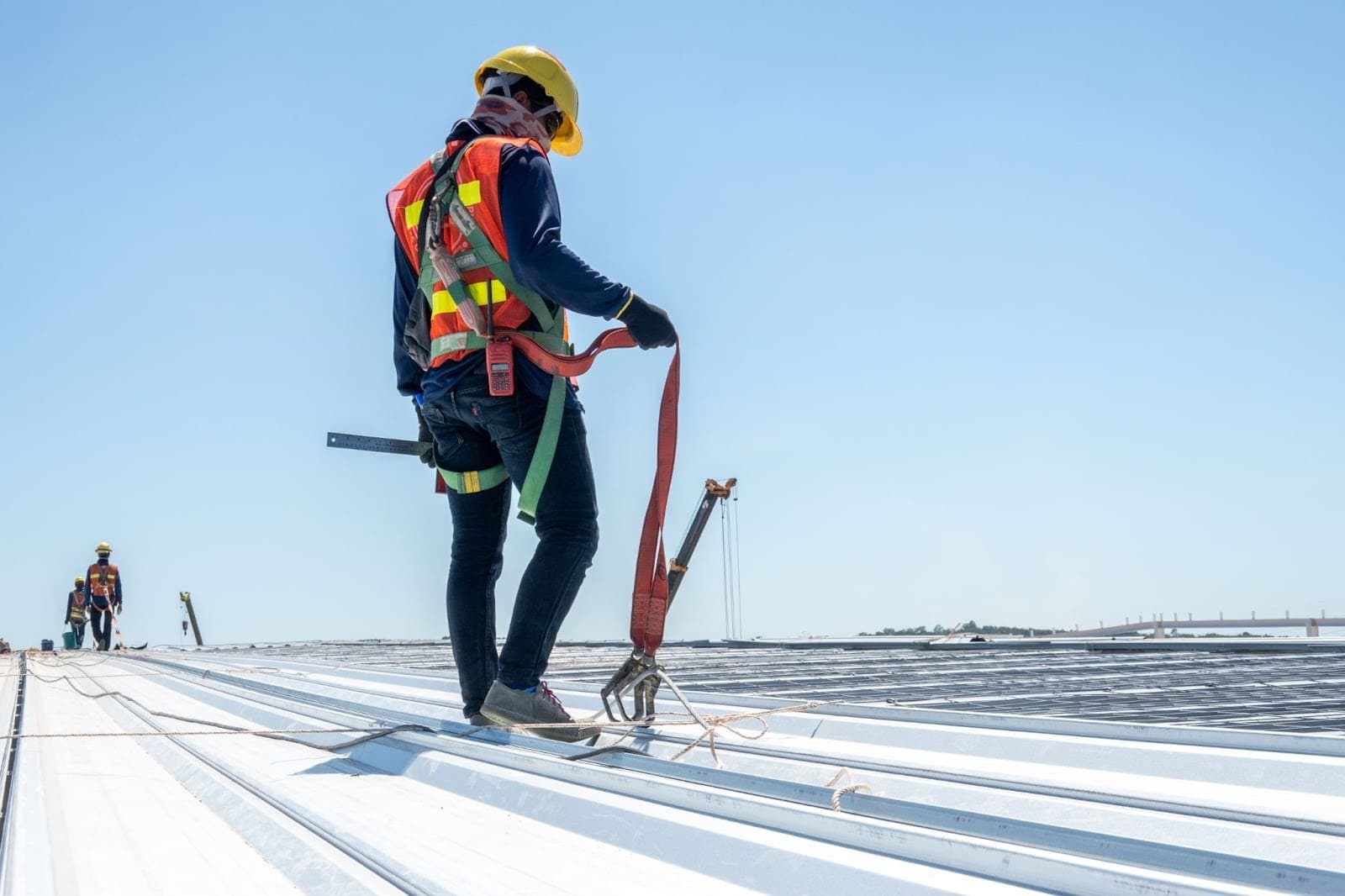 Large commercial metal roof with drainage and roof services