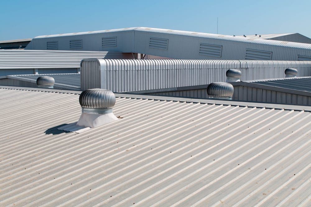Industrial metal roof with ventilation units