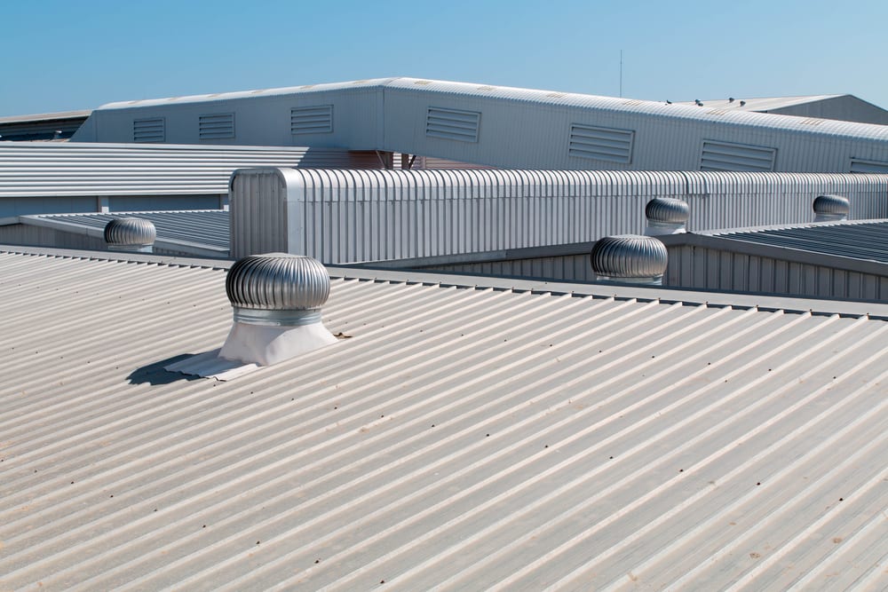 Industrial metal roof with ventilation units