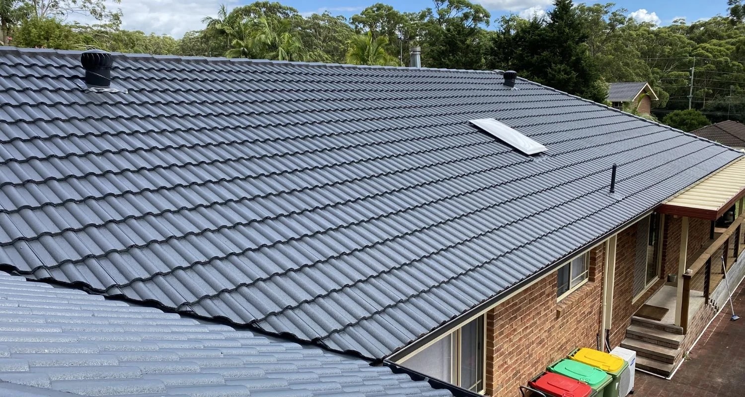 Pitched tiled roof across a residential roofline