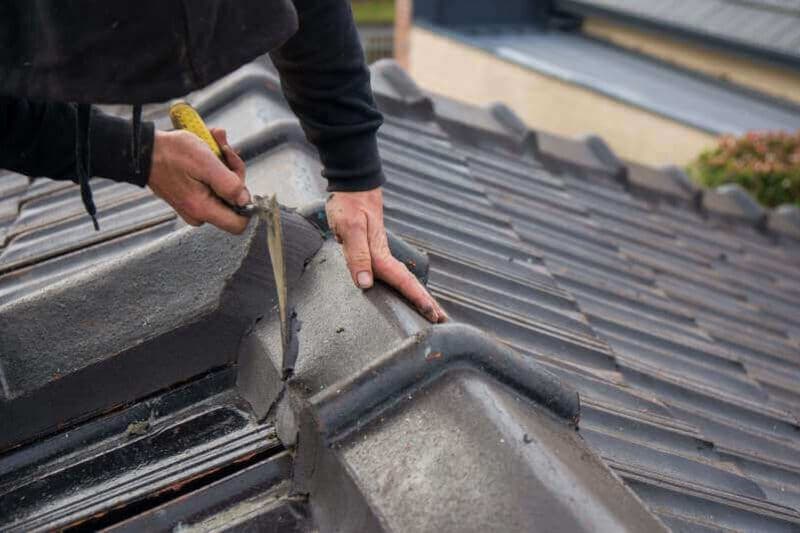 Pointing along tiled roof ridge caps